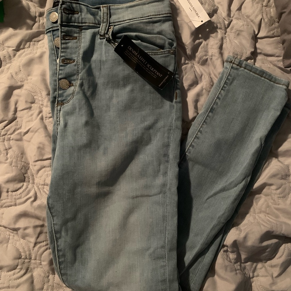 Button fly skinny jeans